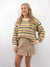 multicolor crew neck sweater on model from front with wool style skirt