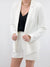 white dressy shorts on model with blazer