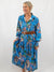 blue safari print midi dress on model from front