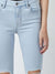 light wash skinny jeans distressed up close
