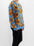 blue sweater with orange flowers from side on model