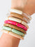 stacked acrylic bracelets in various styles and colors