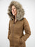 brown puffer jacket with fur hood from the front with hood on