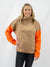 orange, tan, and pink turtleneck sweater