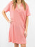 light pink sweater style short sleeve dress on model