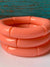 chunky acrylic bracelets in coral stacked
