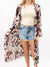 metallic cow print duster on model from front