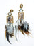 boho style long feather earrings with cowry detailing