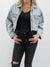 light wash cropped denim jacket from front