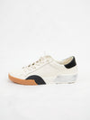 Dolce Vita Zina White and Black Leather Sneaker shown from side