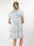 floral patterned mini dress with ruffle detail on sleeves from back