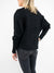 black ribbed knit sweater from back