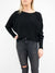 black ribbed knit sweater tucked in