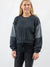 black two-tone pullover on model