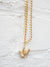 close up of gold chain necklace with pave i love you symbol pendant