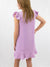 lavender ruffle dress on model from back