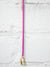 neon pink enamel necklace with gold carabiner hanging
