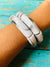chunky acrylic bracelets in marble white on arm