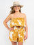 tie dye ruffled top mustard romper paired with summer straw hat