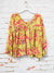 yellow babydoll style top with floral pattern