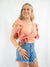 linen ruffle top in coral from the front