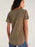woman in olive tee from the back