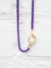 closeup of pave clasp purple choker necklace