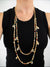 shell and cowry layered necklace with black tank