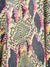 close up of neon snake print shorts
