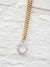 pave sun necklace on gold chain close up