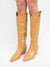 tan western style knee boot with heel from front