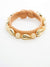 Neutral color braided bracelet with gold cowry shells and beads