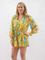 yellow floral romper on model from front