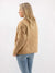 tan quilted jacket from back on model