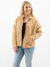 tan quilted jacket on model